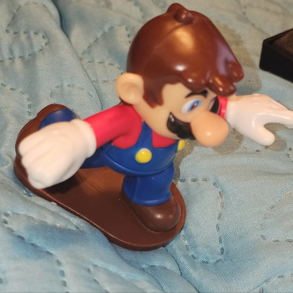 McDonald's Happy Meal toy featuring Mario from the Super Mario Bros. franchise.‎